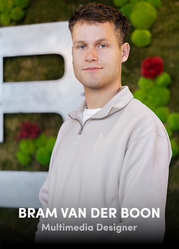 Portrait of Bram van der Boon, Multimedia Designer, in a white shirt with a green wall background.