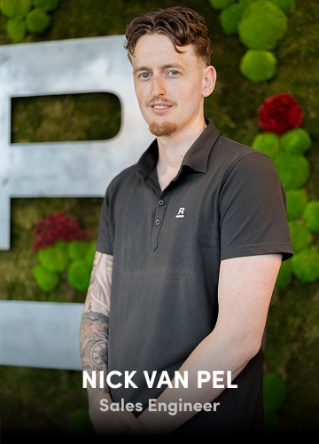 Portrait of Nick van Pel, Sales Engineer, wearing a grey polo shirt with a green wall backdrop.