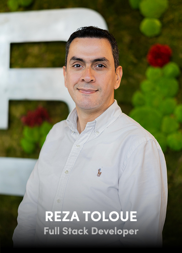 Portrait of Reza Toloue, Full Stack Developer, in a white shirt with a decorative green background.